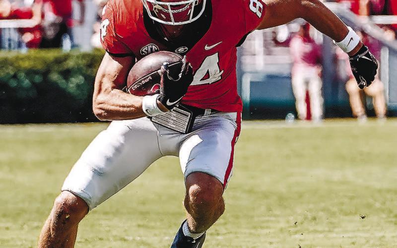 Georgia wide receiver Ladd McConkey (84) cuts up field before stepping out-of-bounds on a catch against Kent State. JACK OZMER/UGA Athletics
