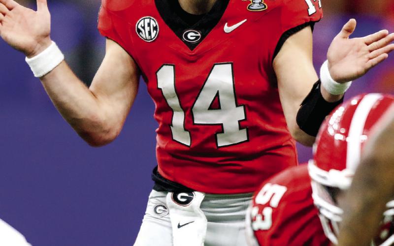 Georgia quarterback Gunner Stockton (14) gets set to snap the ball during the third quarter of the Allstate Sugar Bowl against Notre Dame. (LANCE MCCURLEY/Staff)