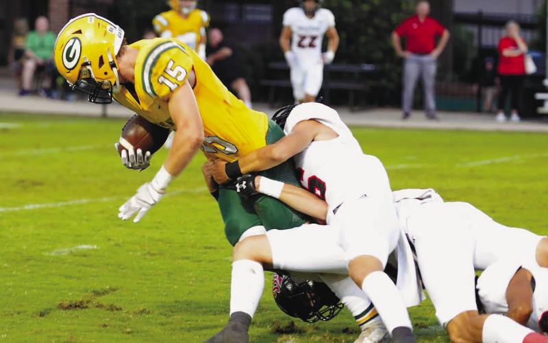 Gatewood senior Lawson Wooten (15) scored twice last Friday against CFCA in Macon, including a fumble recovery in the end zone after a botched CFCA punt attempt. IAN TOCHER/File photo