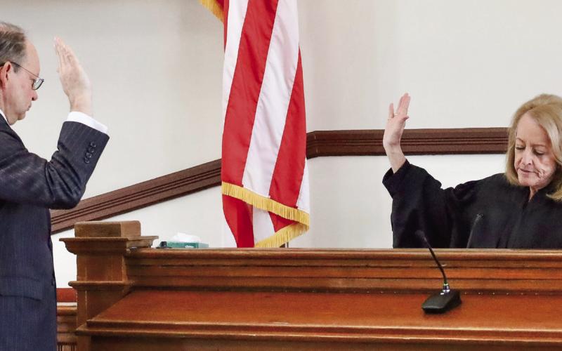 Stephen A. Bradley is sworn in for another term by Judge Brenda H. Trammell. Both are superior court judges of the Ocmulgee Judicial Circuit as well as Putnam County residents. CONTRIBUTED/Alyssa Martinez