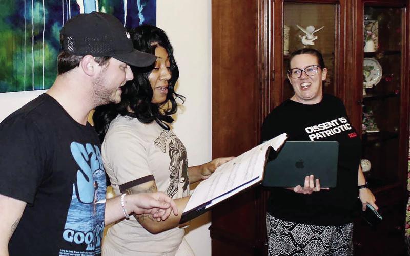 L-R: Tyler Stella and Ariel McKinney rehearse a song for “Hairspray the Musical,” with stage manager Anna Walker looking on in The Plaza’s foyer. CONTRIBUTED