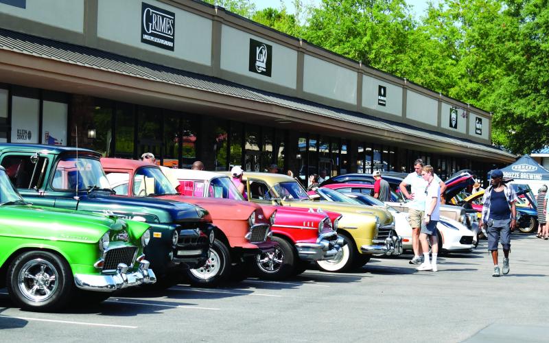 Dozens of hot-rodded rides showed up Saturday for the inaugural Bruzze Brewing Classic Car Show, staged in honor of Jerry Smith, who once operated a car museum in the same space the brewery now occupies alongside Scott Road in eastern Putnam County. (T. MICHAEL STONE/Staff)