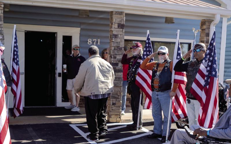 The Honor Flag line supports the wounded veterans as they arrive at the Elks Lodge. LEIGH LOFGREN/Staff