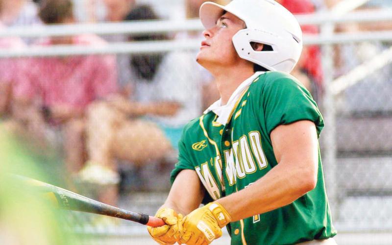 Ames Johnson stares down the ball as he hits his first home run of the season. (TREY NORRIS/Staff)