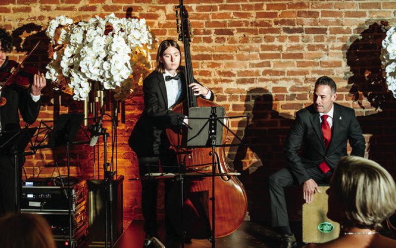 Celebrated violinist and arts educator Amy Schwartz Moretti (left) performed at OPAS Soirée en Blanc &amp;amp; Noir with her Mercer University string students. CONTRIBUTED