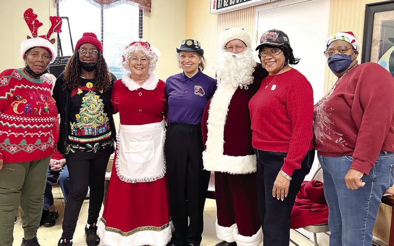 Alongside Santa and Mrs. Claus, the Eatonton American Legion Auxiliary Unit 583 participated in the Georgia War Veterans Home Joy Shop, including (l-r) Secretary Alma Stokes, member Dorothy Griffen, historian Vernel Warren, President Helen Nelson and member Valerie Hurt. CONTRIBUTED