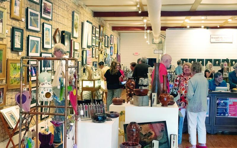 Visitors explore the MAG Gallery at 125 W. Jefferson St. in Madison. LEIGH LOFGREN/Staff