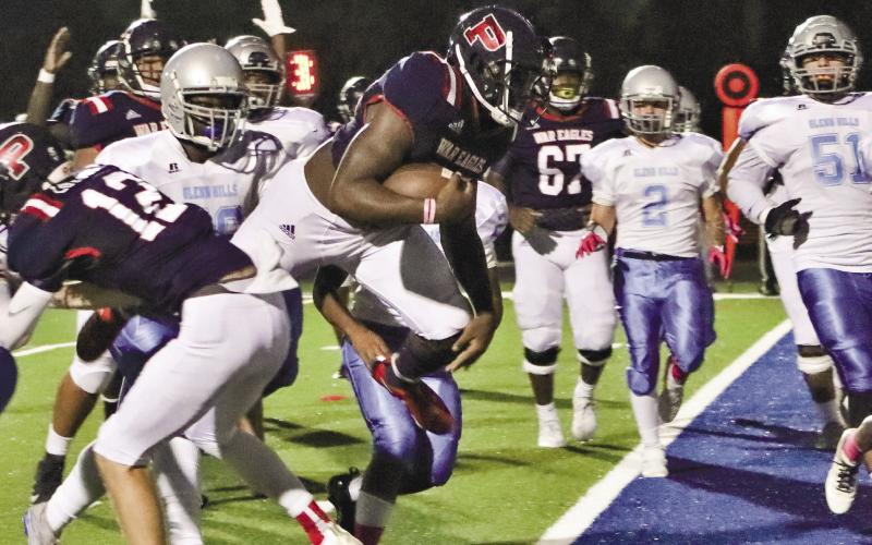 Peters (27) crosses the goal line for a score against Glenn Hills last season. ARELLA CASH/Staff