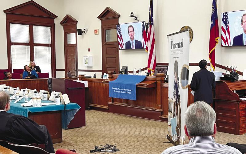 A video message from Georgia Governor Brian Kemp congratulated PAC graduates James Brock, Gregory Burke, Bashun Carter, Clarence Hill, George Hulsey, Mel-Juwan Lewis, Marcus Mathis and Michael Peek.