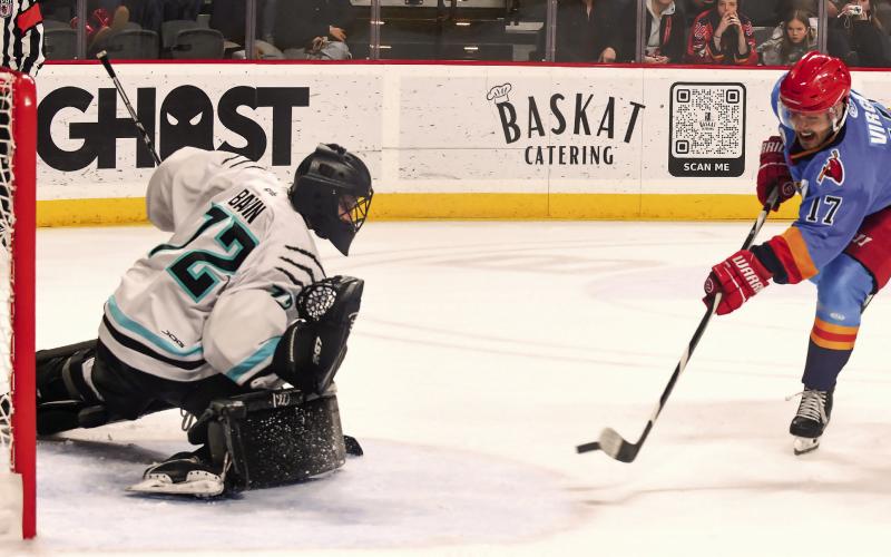 Rock Lobsters veteran Filip Virgili fires the winning goal in the shootout past Columbus goaltender Trevor Babin. IAN TOCHER/Staff