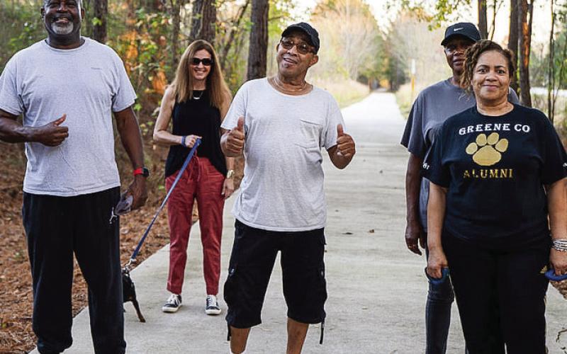 A group of pedestrians enjoys a walk on the Firefly Trail. CONTRIBUTED
