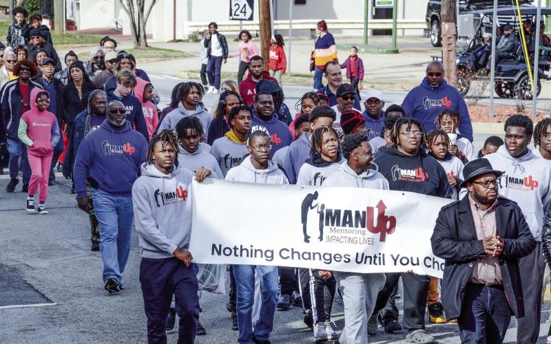 Putnam County residents march on MLK Day last week. IAN TOCHER/Staff
