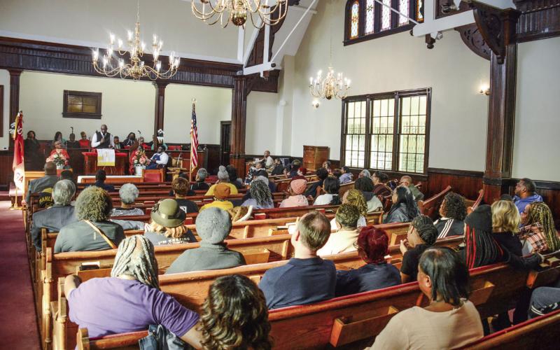 A sizable crowd gathered at Ebeneezer Baptist Church on Willie Bailey Street in Eatonton Monday afternoon. IAN TOCHER/Staff