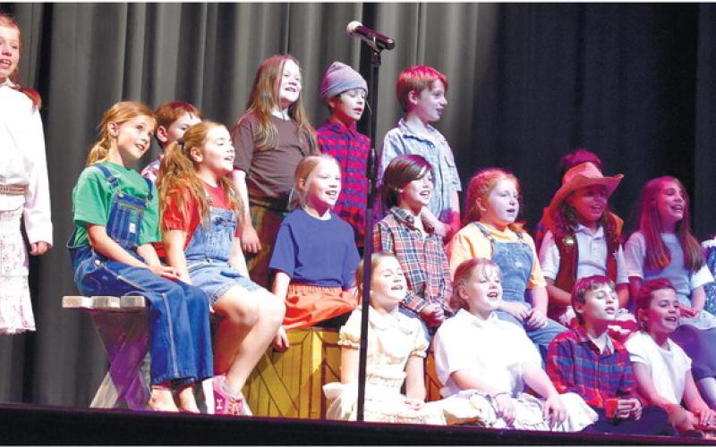 A group of young actors is sing a song about Davy Crockett. LENA HENSLEY/Staff