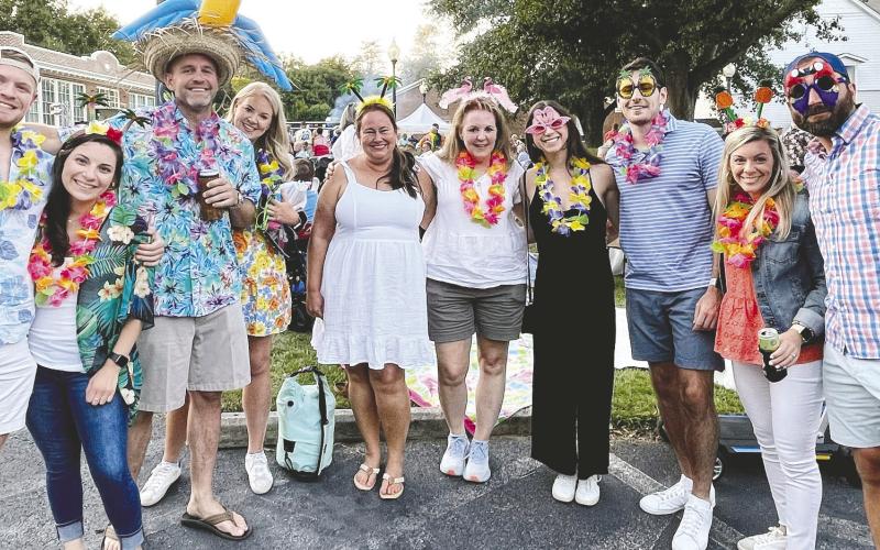 Family and friends pose together while enjoying the festivities of last year’s AIA show at The Plaza. CONTRIBUTED