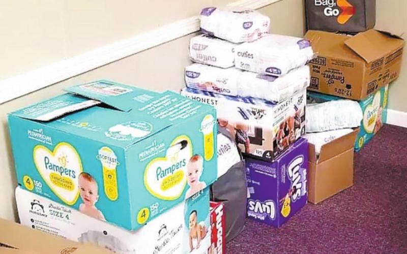 Diapers are stacked and ready to be given to families in need. CONTRIBUTED