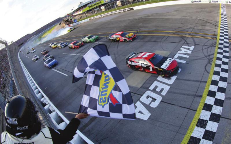 Ross Chastain, driver of the #1 Moose Fraternity Chevrolet, takes the checkered flag to win the Cup Series GEICO 500 at Talladega Superspeedway Sunday. (James Gilbert/Getty Images)