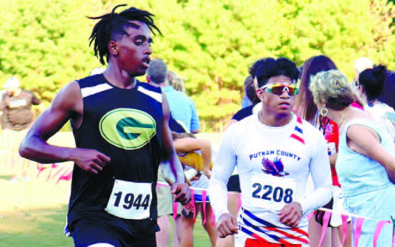 In the largest field at the Redskin Invitational, Putnam High’s Cristian Hernandez (right) fi nished 18th of 78 entries in the varsity Boys’ 5K with a time of 20 minutes, 4 seconds. Michael Lynch of Mount Pisgah Christian ran 17:06 to take the win. PCHS had fi ve other runners entered: Sammy Ford, Aidan Chaffi n, Jacob Barbee, Luke Armistead and Mark Winslette, with each finishing deep in the field.