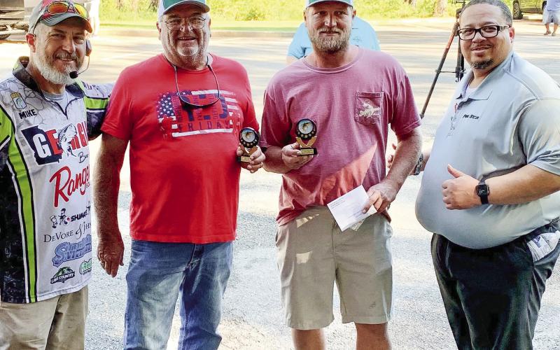 Mike Tarrar of Georgia Bass Trail (left) and Roosevelt Adams of Five Star Automotive (right) presented third-place trophies to John Duvall and Billy Duvall. 16.46 pounds of fish. Fourth were Carl Hayes and Chris Wilson with 16.30 pounds, and fifth place went to Cooper McLemore and Brett Boswell with 15.70 pounds of bass. The tournament’s big fish was caught by Henry and Kimmel and weighed 5.49 pounds. CONTRIBUTED