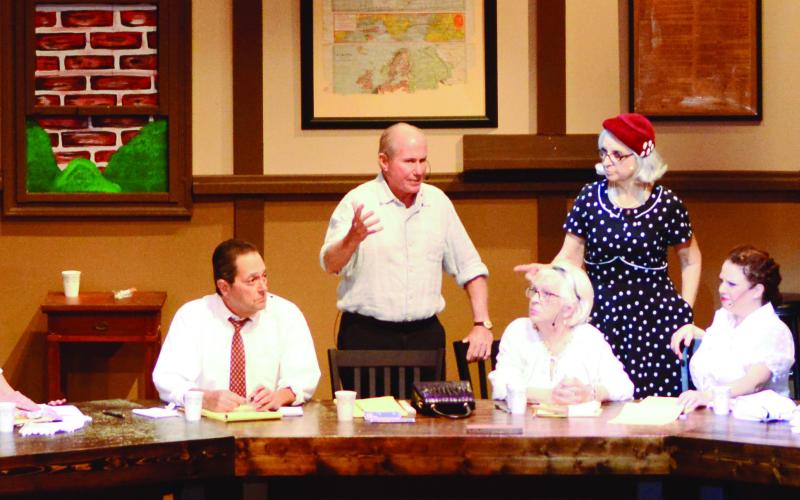 The 12 Angry Jurors (l-r): Phil Armstrong (2), Michelle Saarela (12), Brent Mero (10), Sue Strange (9), Lou Benjamin (8), Bill Dudley (3), Sandy Young (6), Darlene McCumiskey (7), Becky Nipper (5), Dianne Bennett Shinneman (4), Johnny Wagoner (1, Foreman), and Gretter Naranjo (11).