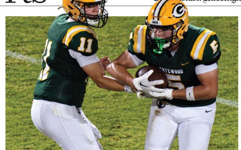 Freshman quarterback Bennett Haley (11) completes a first-quarter handoff to his brother, Brady, last Friday night in Gatewood’s 30-6 win over the visiting Riverside Military Academy Eagles.