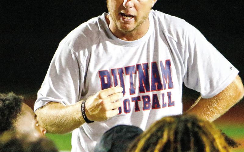 Putnam head coach Joel Harvin speaks to his team following last Friday’s tough loss to the Tigers. (LANCE MCCURLEY/Staff)