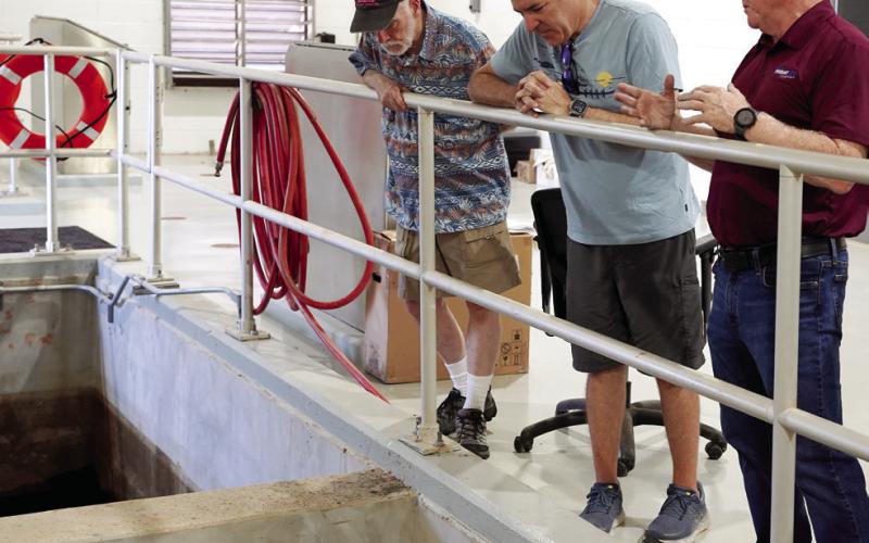 Ed Hall (right), director of operations at Piedmont Water Company’s treatment plant, guided visitors on a July 8 site tour. SKYLA MORRIS/Staff