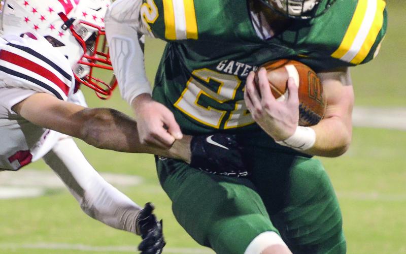Senior Hunter Johnson made a strong run to score Gatewood’s first touchdown, diving across the goal line with two EBA defenders in tow. IAN TOCHER/Staff