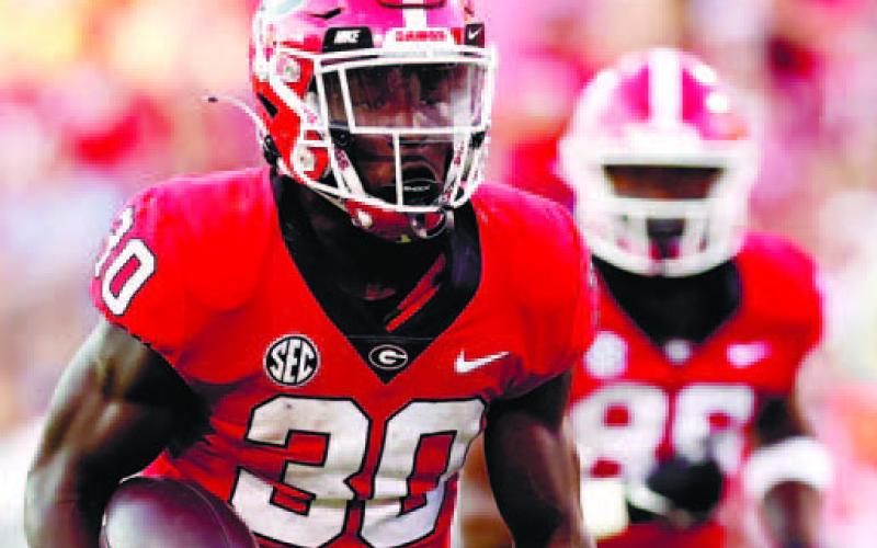 Georgia running back Daijun Edwards (30) was the second-leading rusher Saturday, contributing 83 yards of the team’s 292 total. TONY WALSH/UGA Athletics
