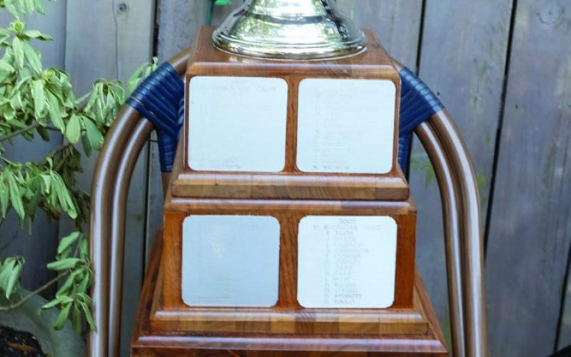Each year’s winners names are engraved on the base of The Oconee Cup trophy. (LEIGH LOFGREN/Staff)