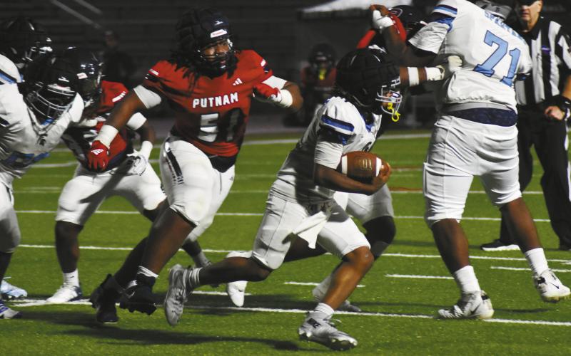 Japeth Nelson (51) chases down a Glenn Hills’ runner last Friday night at home against the Spartans. BRANDON PARK/Staff