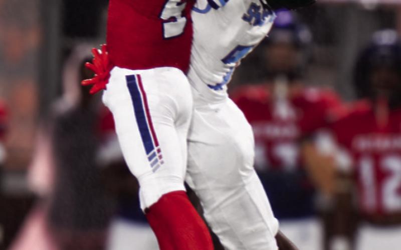 Defensive back Jacob Manning goes up a little higher than a Spartan receiver to knock a pass in the air that ultimately results in a War Eagle interception. BRANDON PARK/Staff