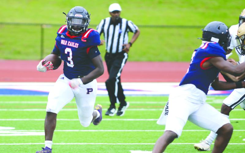 Daniel (3) runs away from Jefferson County defenders toward the sideline in a scrimmage last May. IAN TOCHER/Staff