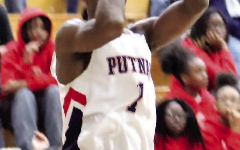 Eren Banks (1) pulls up for a shot earlier this month against Butler. ARELLA CASH/Staff