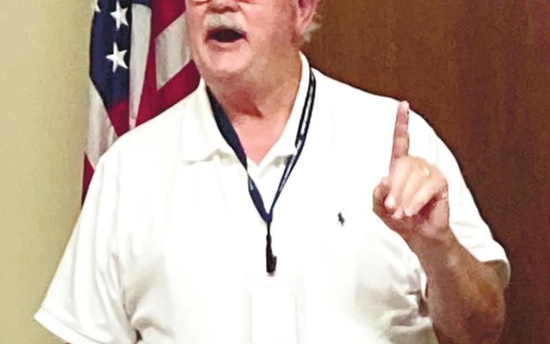 Putnam County Charter School System Director of School Safety Ken Vance explains to local law enforcement officers details behind previous school shootings around the country. LYNN HOBBS/Staff