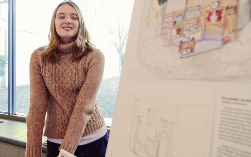 Putnam County High School junior December Arnett was among several students displaying her work last week as part of the “Putnam Model” of education. IAN TOCHER/Staff