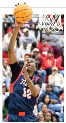 Putnam County boys senior forward Shamar McClendon goes up for a layup inside the paint. LANCE McCURLEY/Staff