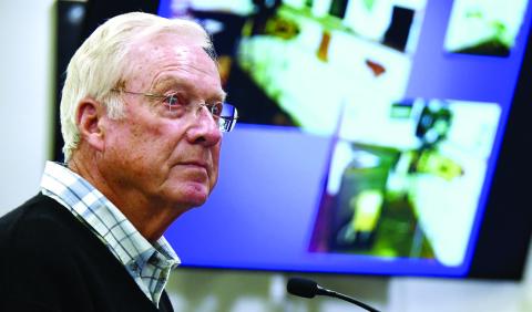 Harold DeLoach with images of the interior of Eatonton’s PEX Theater on the screen behind him. IAN TOCHER/Staff