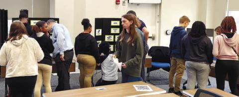 Students visit each station to see how they can budget and spend their money on different things a 26-year-old adult would have to manage in their life. KARA LASSITER/Contributed
