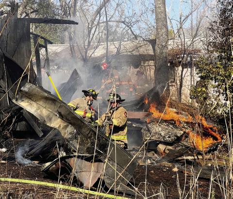 Both Eatonton and Putnam County firefighters responded to Wednesday’s blaze on Mulberry Street in Eatonton. IAN TOCHER/Staff