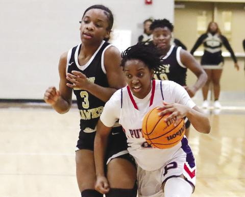 Kamyra Aikens (21) takes it to the basket against Washington County. ARELLA CASH/Staff