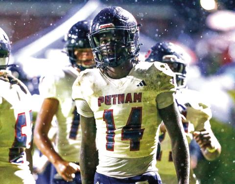 Putnam County senior wide receiver Jayson Smith (14) took a reverse and scored the game-winning touchdown against Haralson County this past Friday. LANCE McCURLEY/Staff