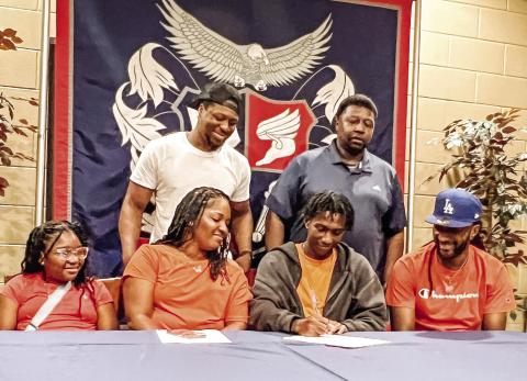 Jaylin Harper signs a letter of intent to attend and play for Brewton-Parker College during an event held for him at Putnam County High School on May 22. CONTRIBUTED