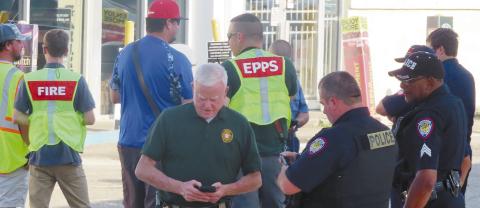 Eatonton police officers, fire department personnel and Putnam County Sheriff’s deputies at the Shell Food Mart on Sumter Street where a shooting happened Sunday. CONTRIBUTED