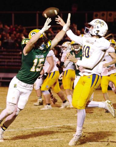 Gators’ senior Lawson Wooten, shown here deflecting a pass attempt by freshman APD quarterback Carter Chavous, had a great game on both sides of the ball for Gatewood Friday night. IAN TOCHER/Staff
