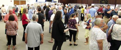 Residents, business owners and community leaders attended the GDOT open house at the Putnam County Administration building on Tuesday, May 7 to see the latest plans for the widening of Highway 44. The project could start early next year. MARK ENGEL/Staff