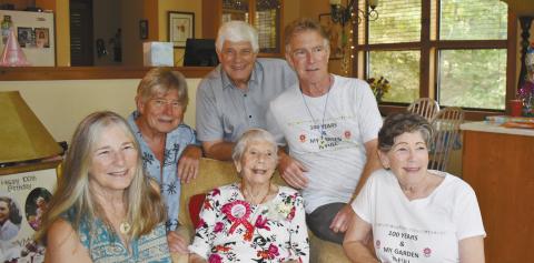 Sandy Mallinson (center), an Eatonton resident since 1989, celebrated her 100th birthday Oct. 6, surrounded by her five children (l-r: Mary Long, Steve, Ed, and David Mallinson, and Jane Paulin) along with her large extended family. CONTRIBUTED BY DEBBIE MALLINSON