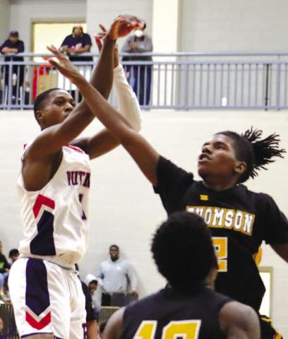 Eren Banks (1) shoots over defenders. ARELLA CASH/Staff
