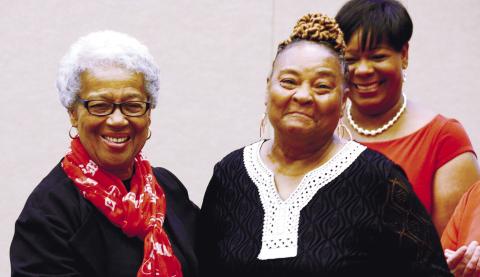 Mothers Against Crime member Brenda Bonner (right), who has been volunteering with the organization since its 1992 inception, received a special service award Saturday night from MAC founder and organizer Georgia Benjamin-Smith. IAN TOCHER/Staff