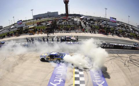 Chase Elliott, driver of the #9 NAPA Auto Parts Chevrolet, celebrates with a sweet burnout after winning the Cup Series DuraMAX Drydene 400 presented by RelaDyne at Dover Motor Speedway Monday. (Tim Nwachukwu/Getty Images)